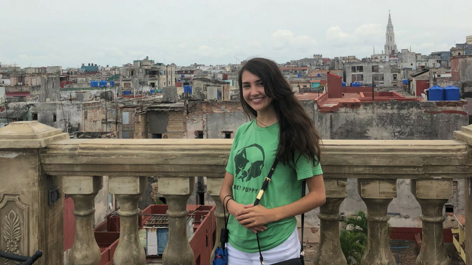 Jessica Anna Perez poses for the camera in front of a view of the city.