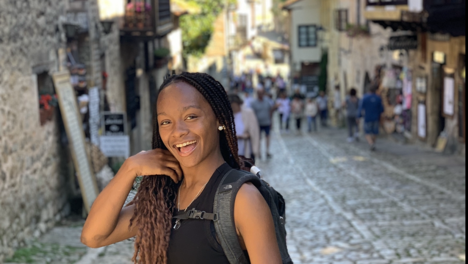 Toinette smiling in the streets of Spain