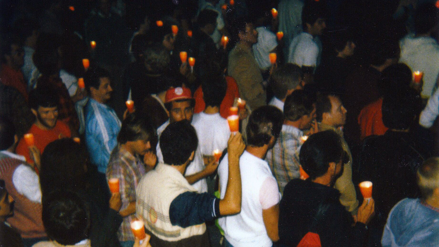 people holding candles