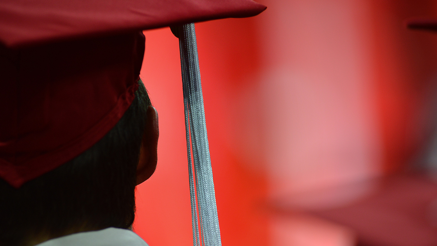 man wearing graduation cap