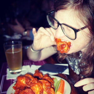 Rachel Wharton eating wings