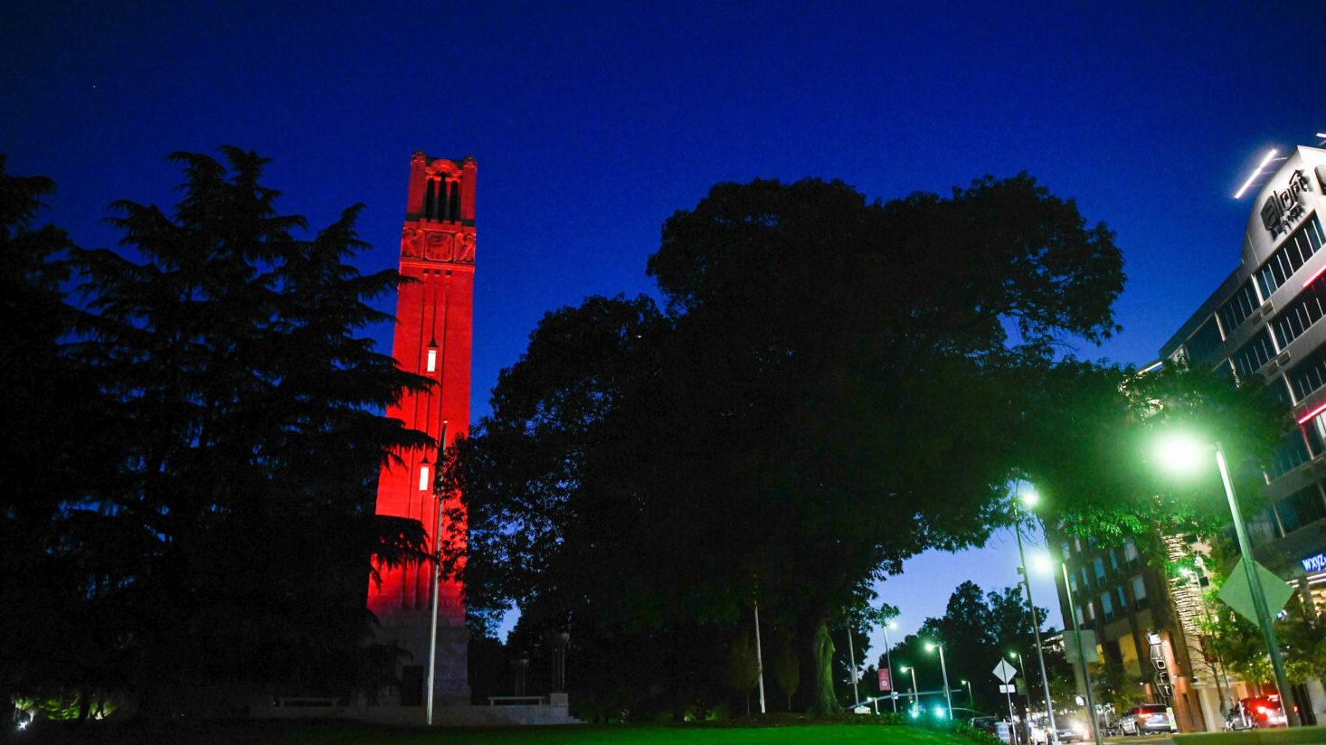 The NC&#160;State belltower, lit red