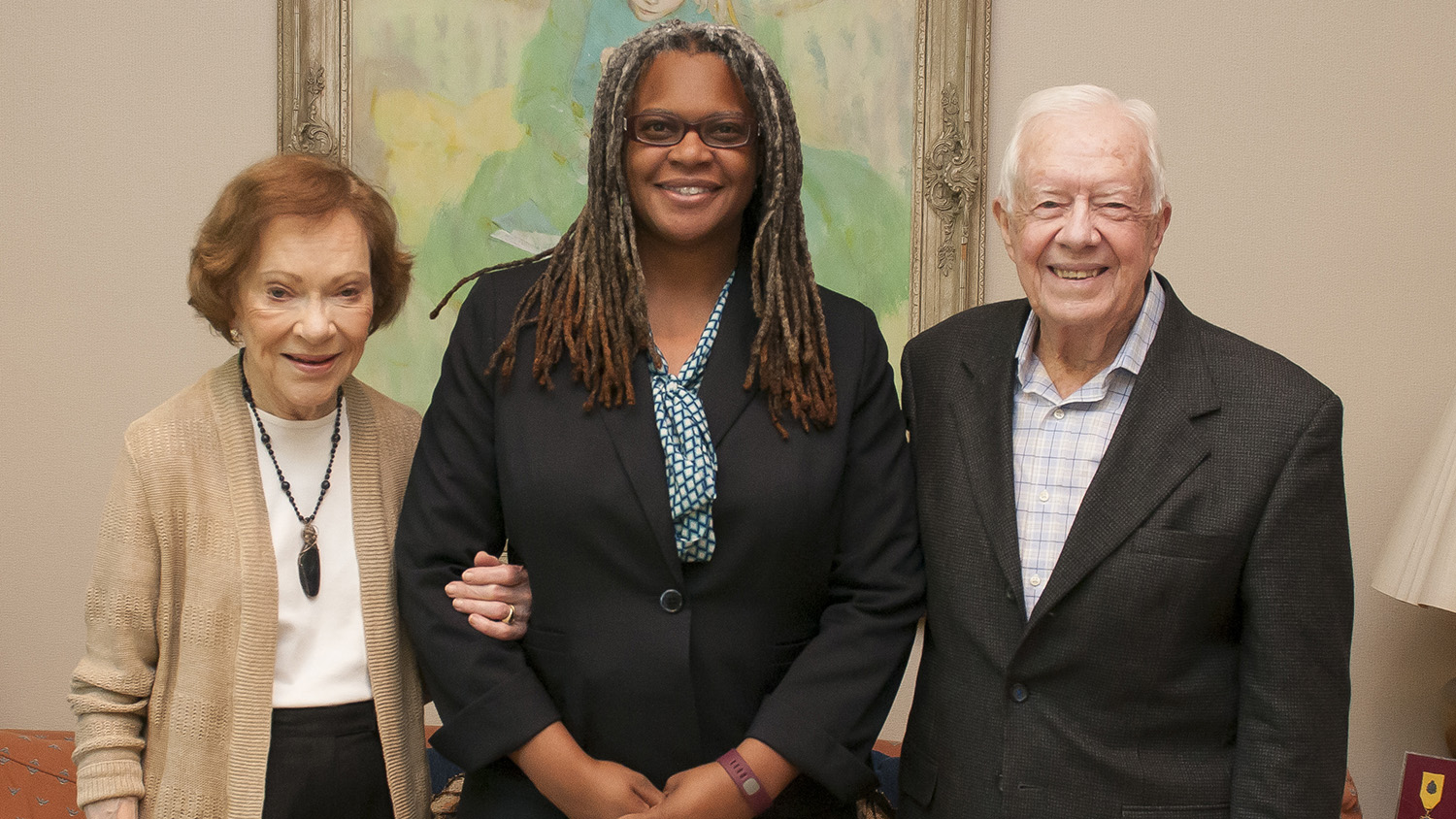 Meredith Evans standing with Jimmy Carter and wife, Rosalynn