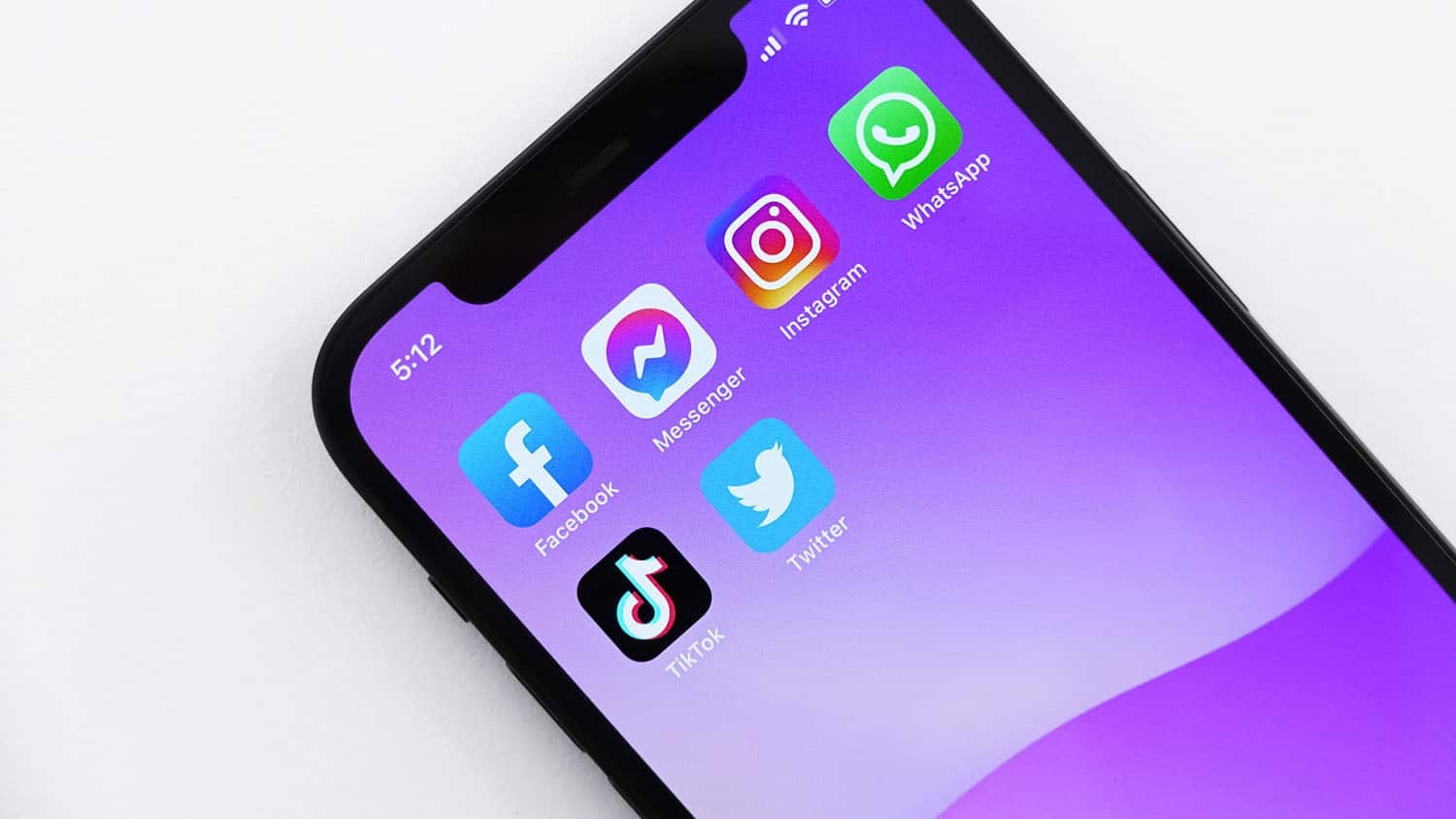 smartphone screen shows social media app icons