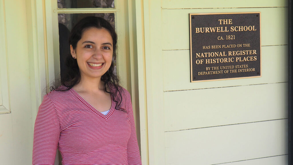 Sarah Waugh in front of The Burwell School