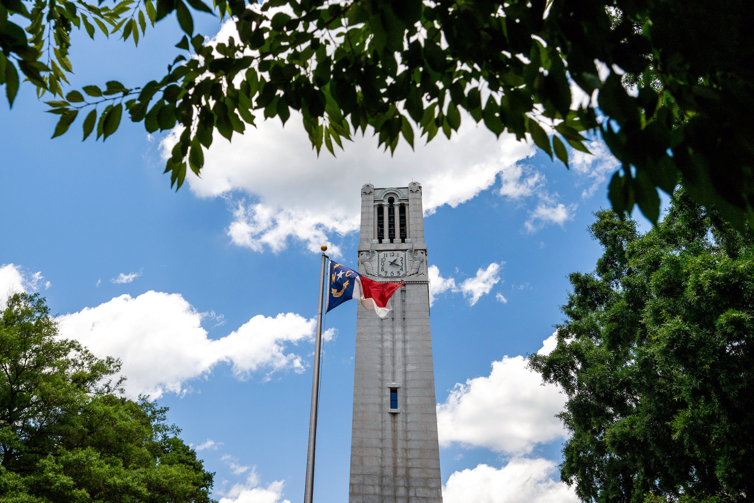 Belltower with the NC flag.