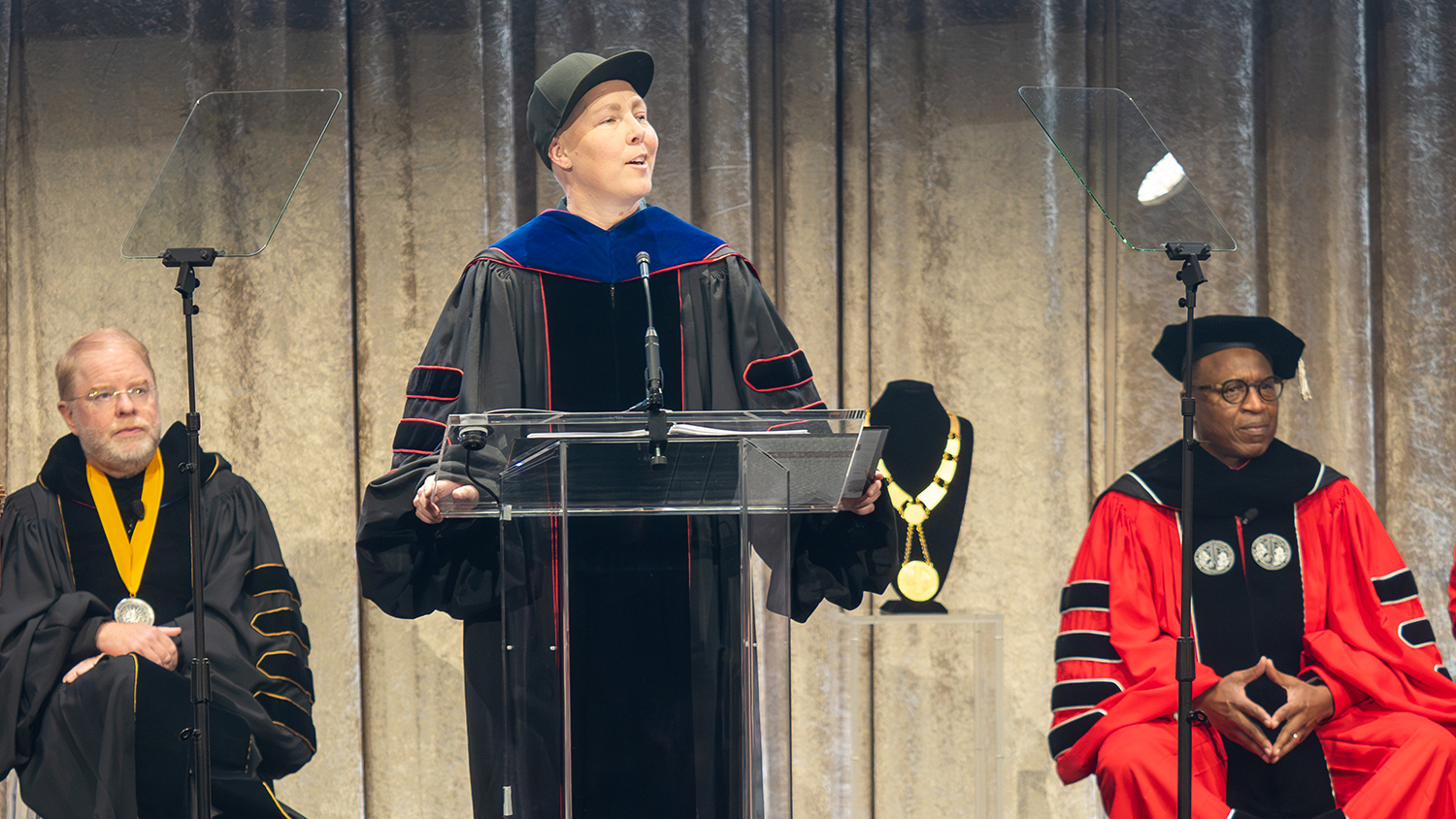 Meg Day recites their poem on stage