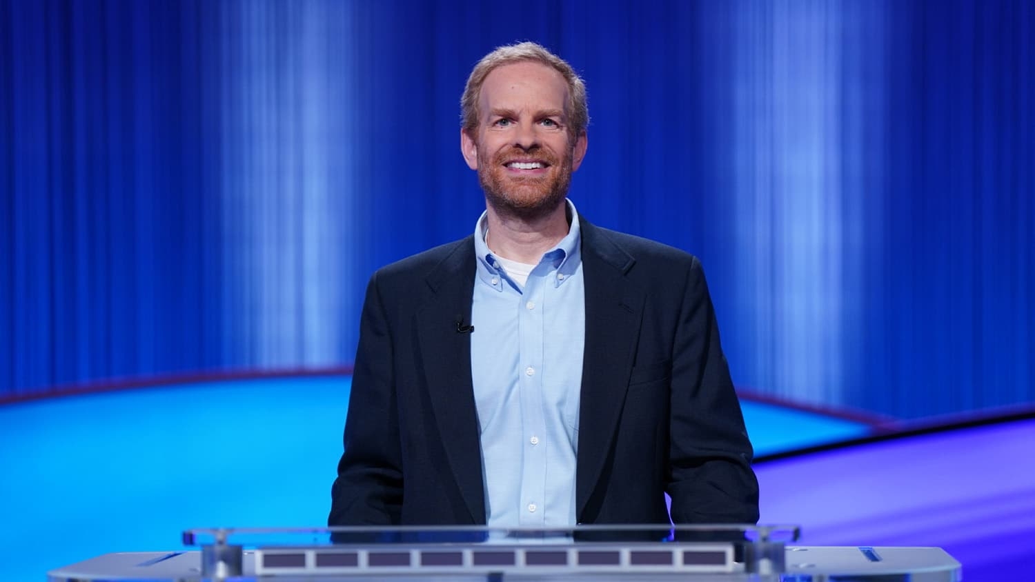 Steven Greene at his podium on the set of Jeopardy!