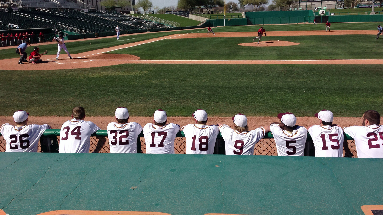 athletes looking at baseball diamond