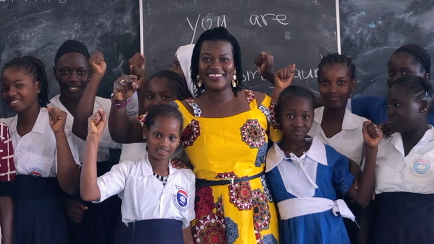 Haddy Njie standing with group of girls