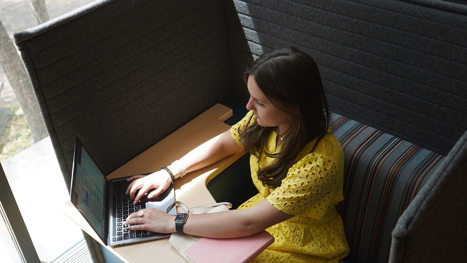 Student at a computer typing.
